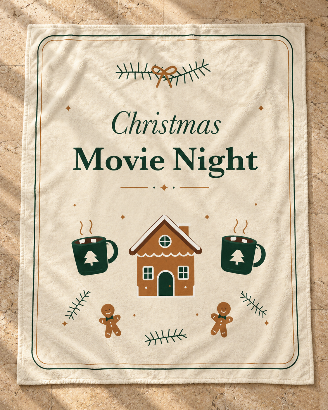 Cream Christmas Movie Night Plush Blanket with green and gold artwork, shown alone on warm tan stone.