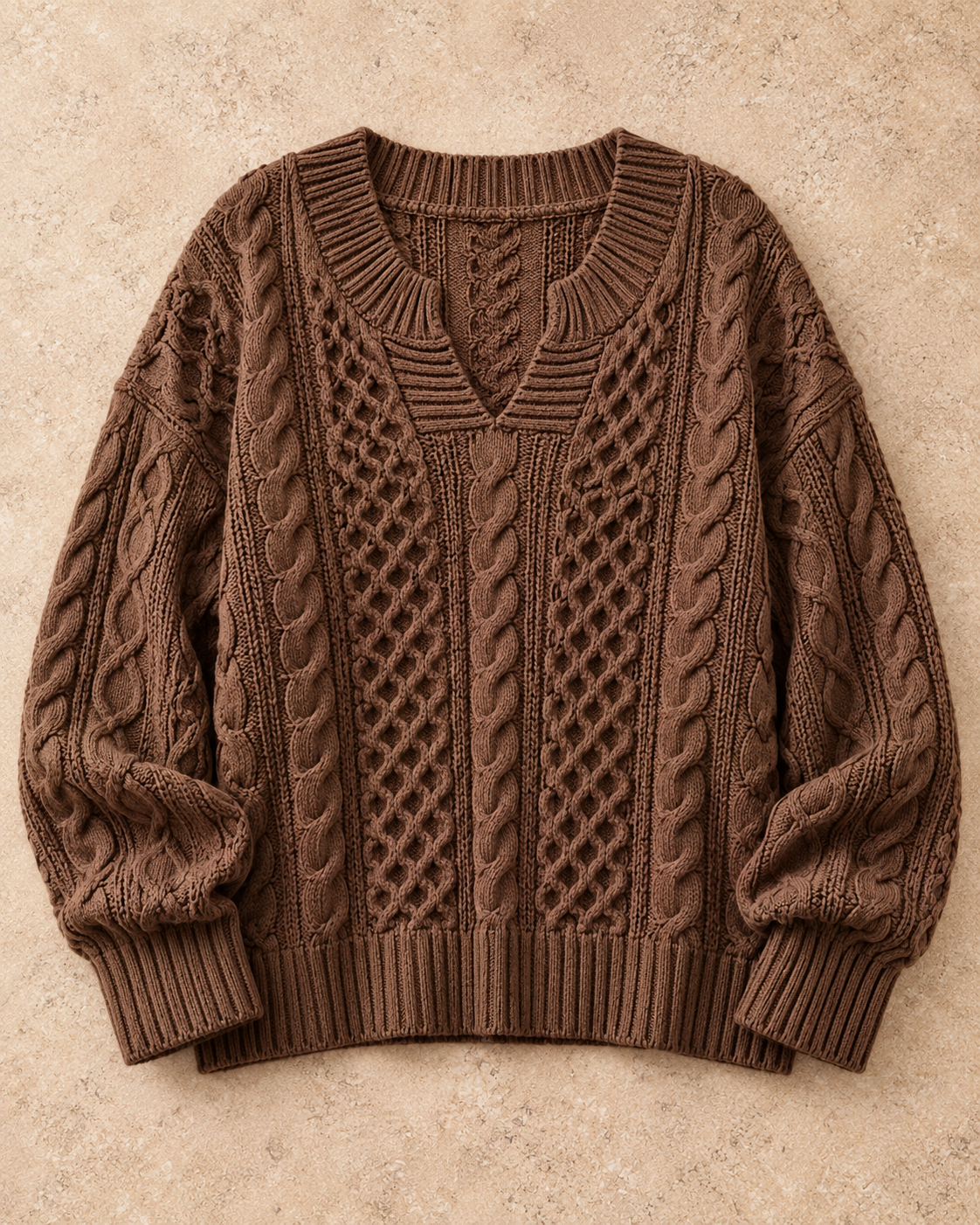 Full Size Cable Knit Dropped Shoulder Sweater Plus Size in Brown — standalone garment on a warm stone studio background