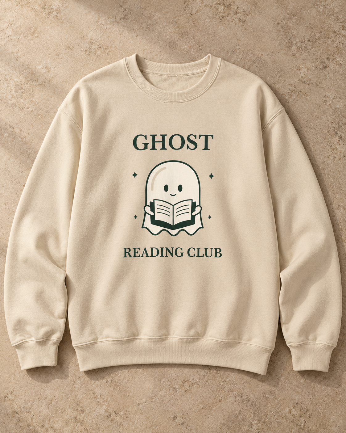 Ghost Reading Club Crewneck in Sand, complete garment and green ghost graphic on warm beige stone.