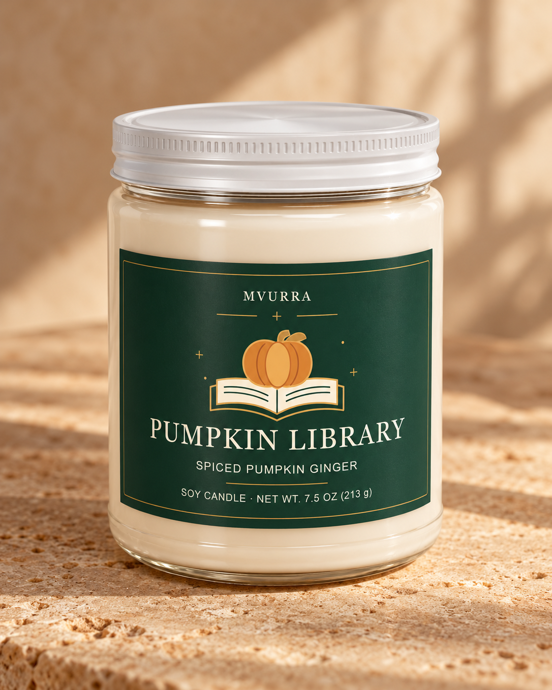 Pumpkin Library Spiced Pumpkin Ginger soy candle with forest-green label and closed white lid on warm tan stone.