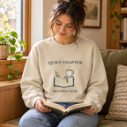 Quiet Chapter Reading Club Crewneck — person use: seated reading indoors; digitally styled supplier-based mockup
